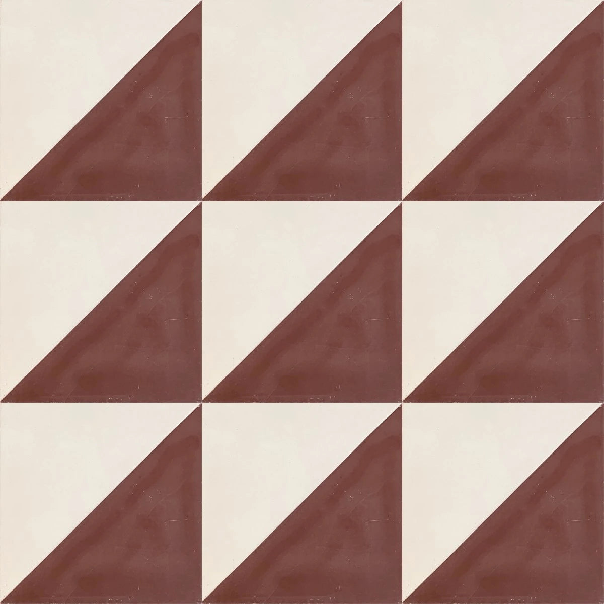 baldosa hidráulica mosaico tapiz en forma geométrica escuadra blanca y roja.